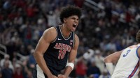 Arizona Wildcats forward Koa Peat (10) celebrates a play against the Florida Gators in the second half of the Hall of Fame Series game at T-Mobile Arena.