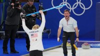 Korey Dropkin and Cory Thiesse of Team United States of Team United States celebrate after winning a mixed doubles curling semifinal match during the Milano Cortina 2026 Olympic Winter Games at Cortina Curling Olympic Stadium.