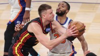 Atlanta Hawks center Kristaps Porzingis (8) looks to drive past New York Knicks guard Mikal Bridges (25) in the fourth quarter at Madison Square Garden.