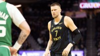 Golden State Warriors center Kristaps Porziņġis (7) comes in as a substitute against the Boston Celtics during the second quarter at Chase Center.
