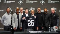 Las Vegas Raiders coach Klint Kubiak (center) poses at introductory press conference at Intermountain Health Performance Center. From left: Marcus Allen, Mike Haynes, Howie Long, Kubiak, general manager John Spyktek, Charles Woodson and Rich Gannon.