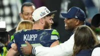 Seattle Seahawks wide receiver Cooper Kupp (10) celebrates with former running back Shaun Alexander after defeating the New England Patriots in Super Bowl LX at Levi's Stadium.