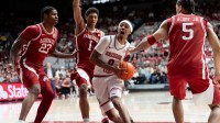 Alabama guard Labaron Philon Jr. (0) drives past Arkansas guard Meleek Thomas (1) in the middle of the lane at Coleman Coliseum.