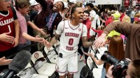 Alabama guard Labaron Philon Jr. (0) leads the team through the fan gauntlet at Coleman Coliseum. Alabama defeated Arkansas 117-115 in double overtime. Philon led Alabama with 35 points.