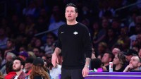 Lakers head coach JJ Redick watches game action against the Boston Celtics during the first half at Crypto.com Arena