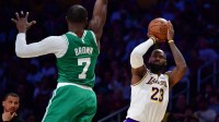 Los Angeles Lakers forward LeBron James (23) shoots against Boston Celtics guard Jaylen Brown (7) during the second half at Crypto.com Arena.