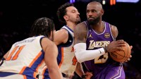Los Angeles Lakers forward LeBron James (23) drives to the basket against New York Knicks guards Jalen Brunson (11) and Landry Shamet (44) during the third quarter at Madison Square Garden.