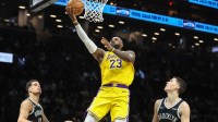 Los Angeles Lakers forward LeBron James (23) drives past Brooklyn Nets guard Egor Demin (8) in the third quarter at Barclays Center.