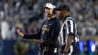 Southern California Trojans head coach Lincoln Riley talks to an official during the first half against the Notre Dame Fighting Irish at Notre Dame Stadium.