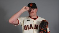 San Francisco Giants pitcher Logan Webb (62) poses during Photo Day at Scottsdale Stadium.