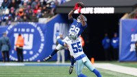 Dallas Cowboys linebacker Logan Wilson (55) breaks up a pass intended for New York Giants running back Tyrone Tracy Jr. (29) during the fourth quarter at MetLife Stadium.