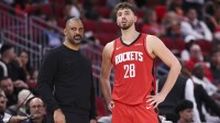 Houston Rockets head coach Ime Udoka and center Alperen Sengun (28) look to the court during the third quarter against the Los Angeles Clippers at Toyota Center.