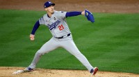 Los Angeles Dodgers pitcher Walker Buehler (21) throws during the first inning in game three of the 2024 MLB World Series against the New York Yankees at Yankee Stadium. Mandatory Credit: Vincent Carchietta-Imagn Images