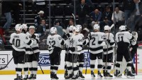 The Los Angeles Kings celebrate a win over the Utah Mammoth after the game at Delta Center.