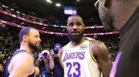 Los Angeles Lakers forward LeBron James (23) talks with Golden State Warriors guard Stephen Curry (left) and forward Draymond Green (right) after the game at Chase Center. Mandatory Credit: Darren Yamashita-Imagn Images