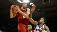 Louisville Cardinals guard Mikel Brown Jr. (0) grabs a rebound in front of SMU Mustangs forward Corey Washington (3) during the second half at Moody Coliseum.