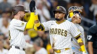 San Diego Padres designated hitter Luis Arraez (4) celebrates with second baseman Mason McCoy (18) after hitting a two-run home run during the second inning against the Milwaukee Brewers at Petco Park.
