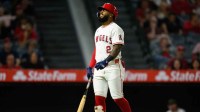 Los Angeles Angels third baseman Luis Rengifo (2) reacts after fouling a ball off his foot during the eighth inning against the Kansas City Royals at Angel Stadium.