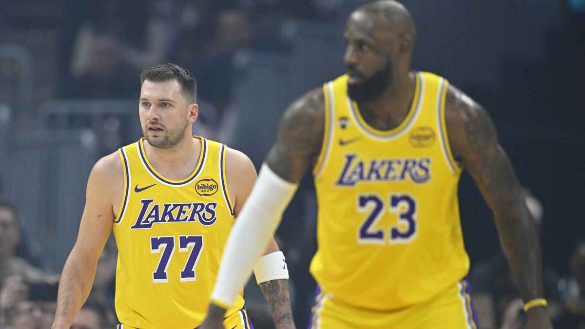 Los Angeles Lakers guard Luka Doncic (77) and forward LeBron James (23) stand on the court in the first quarter against the Cleveland Cavaliers at Rocket Arena.
