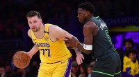 Los Angeles Lakers guard Luka Doncic (77) controls the ball against Minnesota Timberwolves guard Anthony Edwards (5) during the first half in game five of first round for the 2025 NBA Playoffs at Crypto.com Arena.