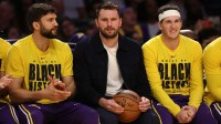 Los Angeles Lakers guard Luka Doncic (middle) watches a game against the Oklahoma City Thunder at Crypto.com Arena.
