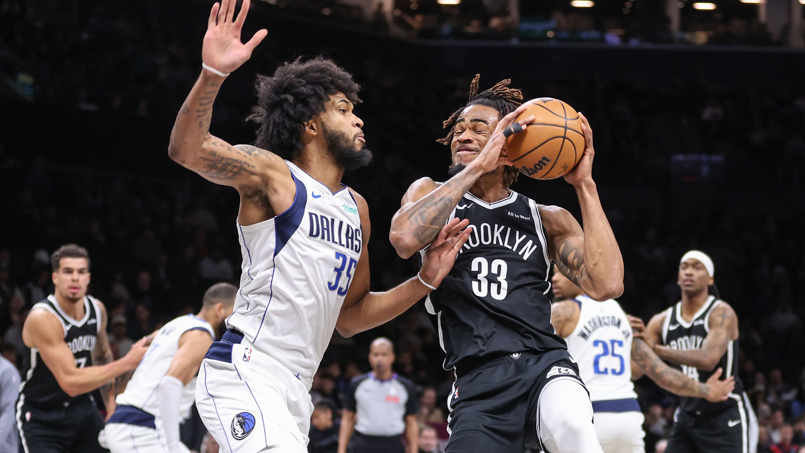 Brooklyn Nets center Nic Claxton (33) looks to drive past Dallas Mavericks forward Marvin Bagley III (35) in the first quarter at Barclays Center.