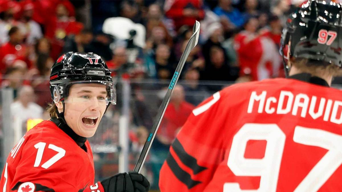 Macklin Celebrini of Canada celebrates with Connor McDavid after scoring their first goal against Czechia in a men's ice hockey quarterfinal during the Milano Cortina 2026 Olympic Winter Games at Milano Santagiulia Ice Hockey Arena.
