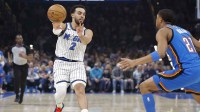 Magic guard Tyus Jones (2) passes the ball