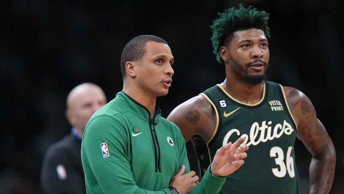 Boston Celtics head coach Joe Mazzulla talks with guard Marcus Smart (36) from the sideline as they take on the Dallas Mavericks at TD Garden.