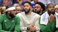 Dallas Mavericks guard Jaden Hardy (1) and forward Anthony Davis (3) and forward Naji Marshall (13) look on during the first quarter against the Phoenix Suns at the American Airlines Center.