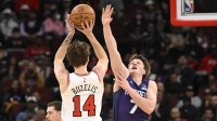 Feb 24, 2026; Chicago, Illinois, USA; Chicago Bulls forward Matas Buzelis (14) shoots against Charlotte Hornets guard Kon Knueppel (7) during the first half at United Center. Mandatory Credit: Matt Marton-Imagn Images
