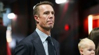 Former Atlanta Falcons quarterback Matt Ryan (2) on the sideline before being inducted in the team’s ring of honor at halftime of a game against the Tampa Bay Buccaneers at Mercedes-Benz Stadium.