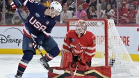 Team Canada goalie Jordan Binnington (50) stops Team United States forward Matthew Tkachuk (19) in the first period during a 4 Nations Face-Off ice hockey game at the Bell Centre.