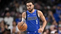 Dallas Mavericks guard Tyus Jones (1) brings the ball up court against the Sacramento Kings during the second quarter at the American Airlines Center.