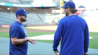 Los Angeles Dodgers third baseman Max Muncy (left) and pitcher Clayton Kershaw (right) talk before the game against the San Francisco Giants at Oracle Park.