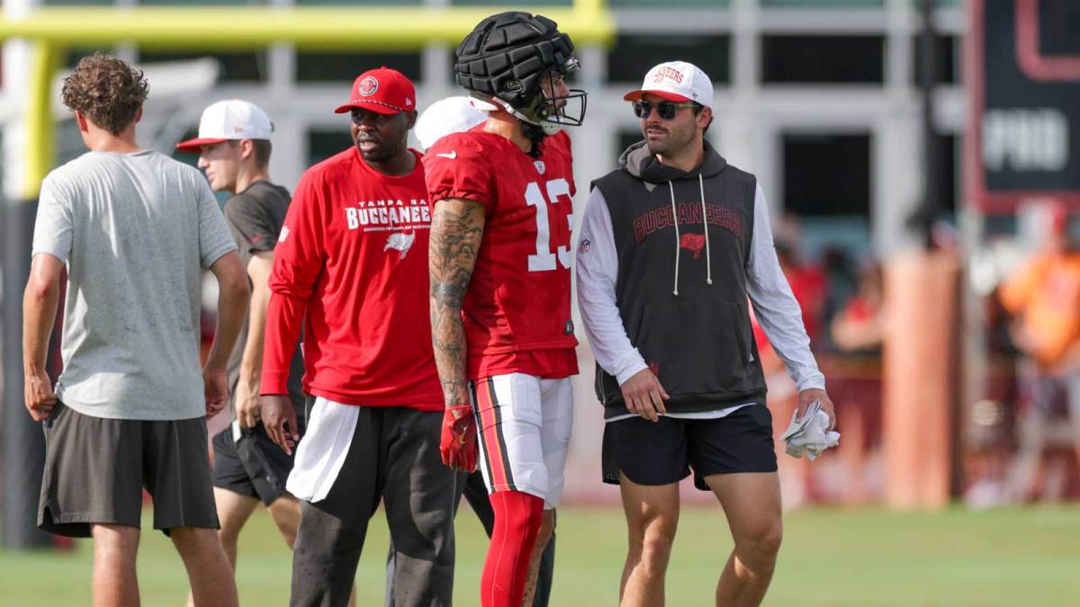 Tampa Bay Buccaneers quarterback Baker Mayfield (6) talks to wide receiver Mike Evans (13) during training camp at AdventHealth Training Center.