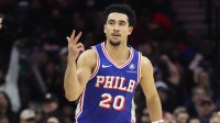 Philadelphia 76ers guard Jared McCain (20) reacts to his three pointer against the Milwaukee Bucks during the first quarter at Xfinity Mobile Arena.