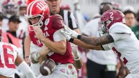 Indiana Hoosiers quarterback Fernando Mendoza (15) loses control of the ball against Alabama Crimson Tide defensive back Zabien Brown (2) on Thursday, Jan. 1, 2026, during the 112th annual Rose Bowl game in Pasadena. Indiana Hoosiers defeated Alabama Crimson Tide, 38-3.
