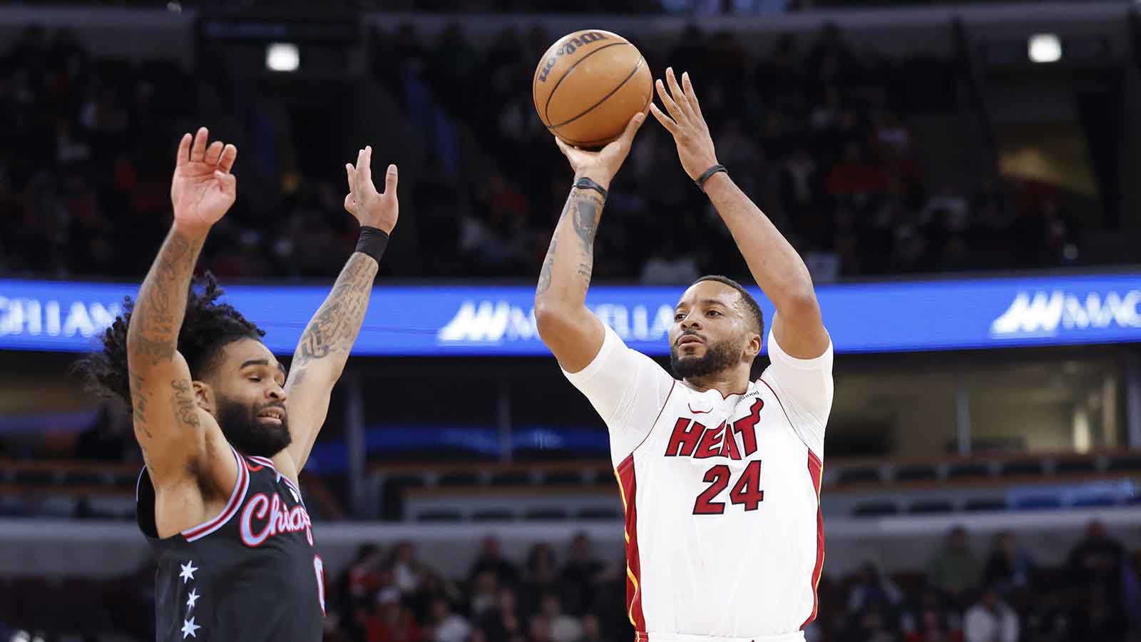 Miami Heat guard Norman Powell (24) shoots against Chicago Bulls guard Coby White (0)