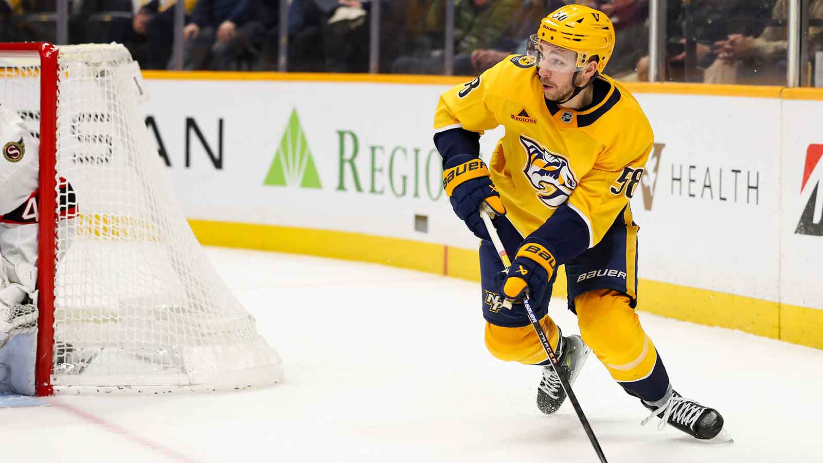 Nashville Predators left wing Michael Bunting (58) skates behind the net against the Ottawa Senators during the third period at Bridgestone Arena