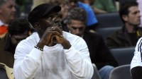 Charlotte Bobcats team co owner Michael Jordan watches on while playing against the Washington Wizards at Time Warner Cable Arena.