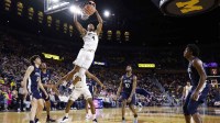 Michigan Wolverines guard Nimari Burnett (4) dunks in the first half against the Penn State Nittany Lions at Crisler Center.