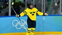 Mika Zibanejad (93) of Sweden celebrates after scoring a goal against the United States in a men's ice hockey quarterfinal during the Milano Cortina 2026 Olympic Winter Games at Milano Santagiulia Ice Hockey Arena.