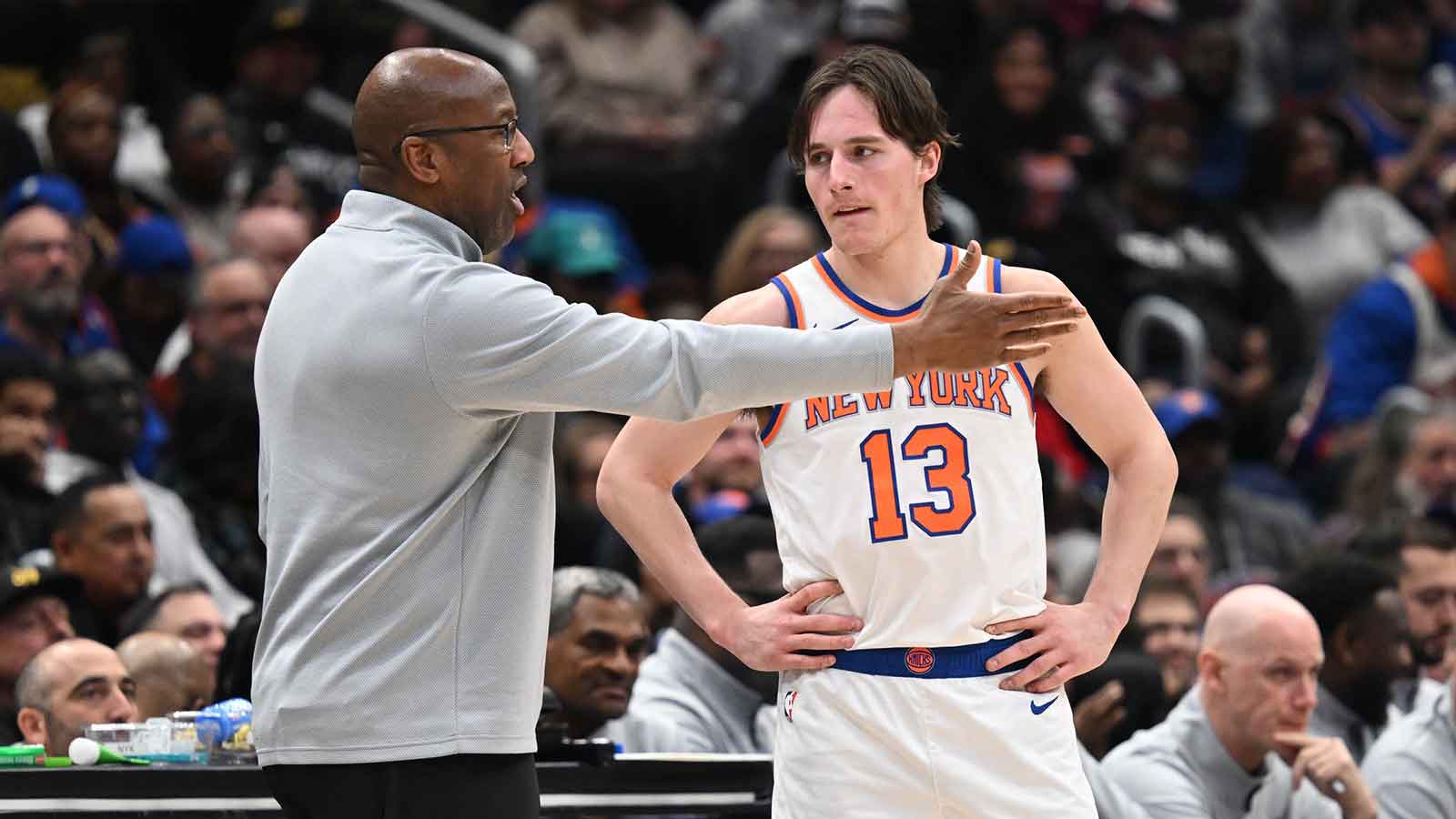 New York Knicks guard Tyler Kolek (13) listens to head coach Mike Brown during a break in the action against the Washington Wizards during the fourth quarter at Capital One Arena.