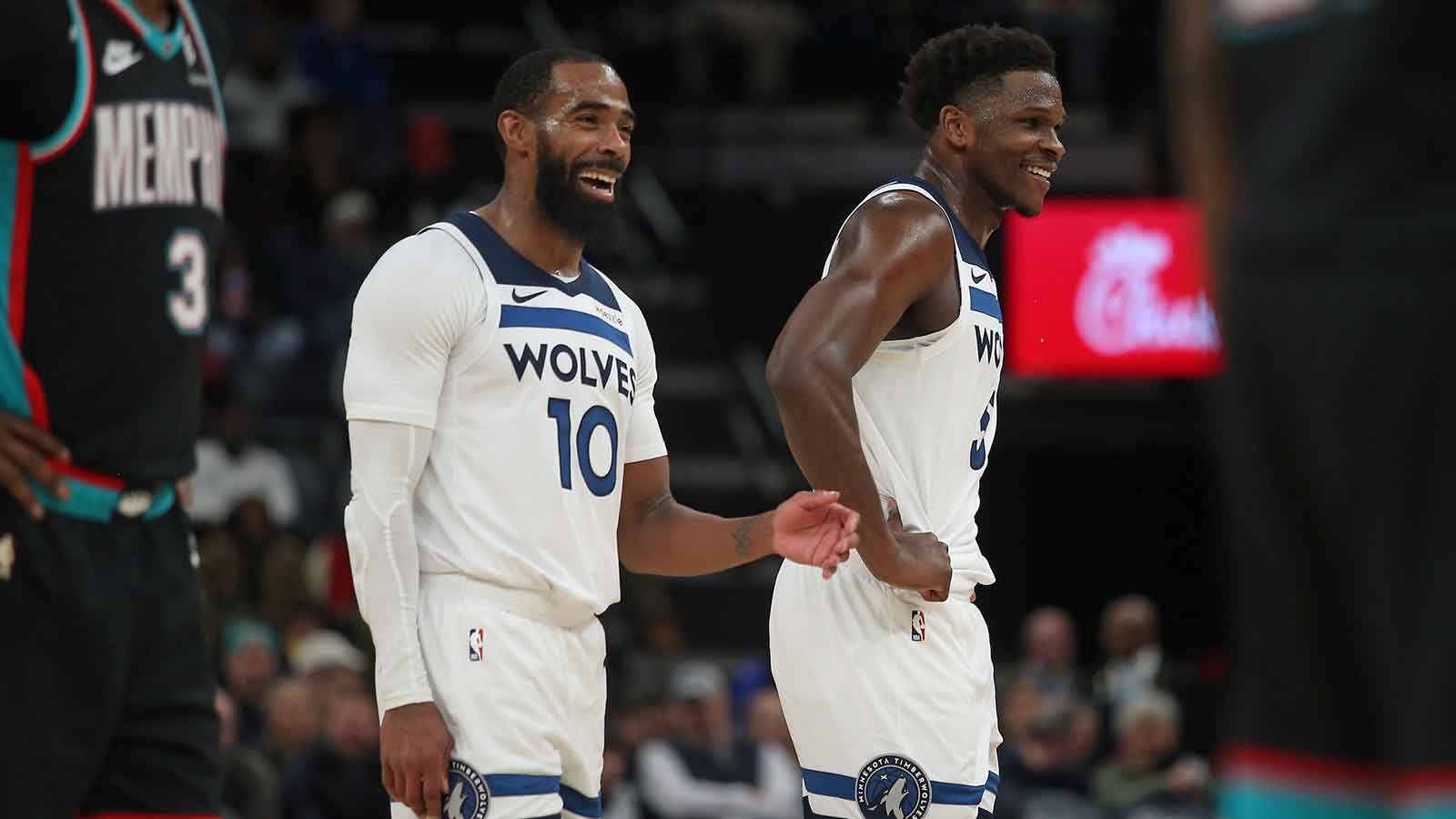 Minnesota Timberwolves guard Mike Conley (10) and guard Anthony Edwards (5) react during the third quarter against the Memphis Grizzlies at FedExForum. 