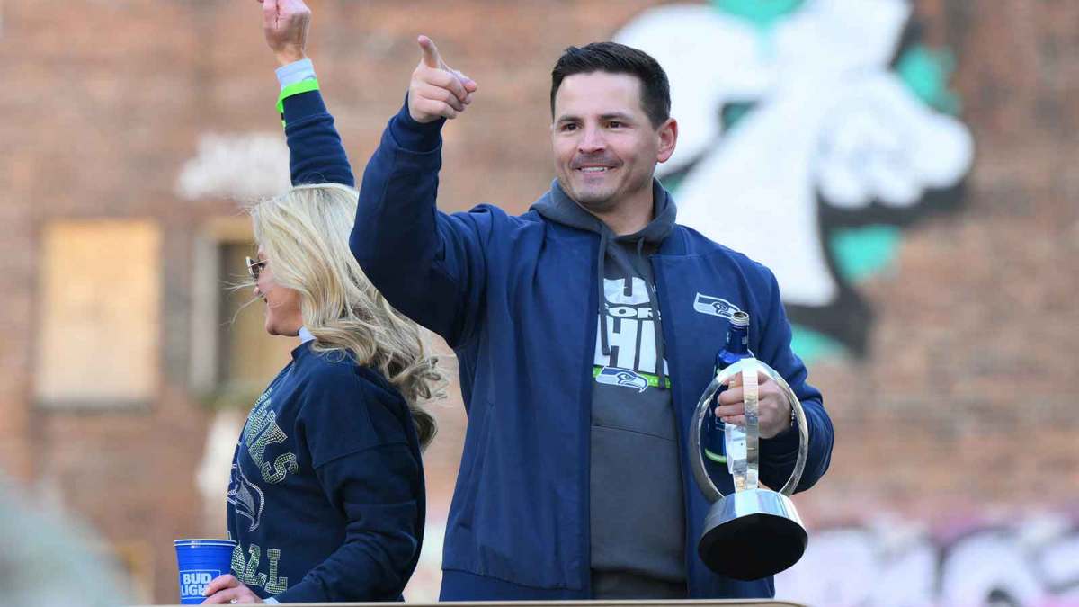 Seattle Seahawks head coach Mike MacDonald interacts with fans during the Super Bowl LX World Champions parade in downtown Seattle.