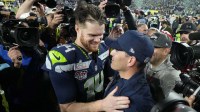 Seattle Seahawks head coach Mike MacDonald celebrates with quarterback Sam Darnold (14) after defeating the New England Patriots in Super Bowl LX at Levi's Stadium.