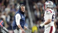 New England Patriots head coach Mike Vrabel talks with offensive tackle Will Campbell (66) during the third quarter against the Seattle Seahawks in Super Bowl LX at Levi's Stadium.