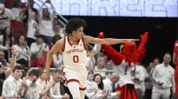 Louisville Cardinals guard Mikel Brown Jr. (0) reacts after making a shot against the NC State Wolfpack during the first half at KFC Yum! Center.