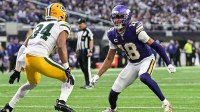 Minnesota Vikings wide receiver Justin Jefferson (18) is defended by Green Bay Packers cornerback Shemar Bartholomew (34) during the game at U.S. Bank Stadium.